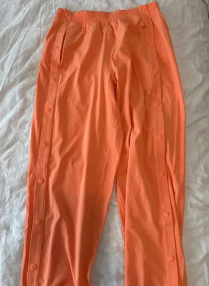 Lululemon size 4 Orange button-up pants Never worn! Brand new! #lululemon #new #buttonup #elastic thumbnail 1