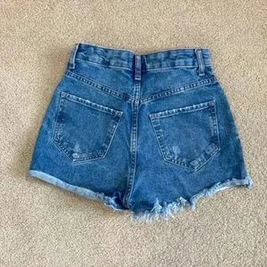 Primark high rise blue distressed jean shorts in size 0 thumbnail 2