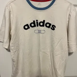 Adidas white short sleeve shirt in size large thumbnail 1