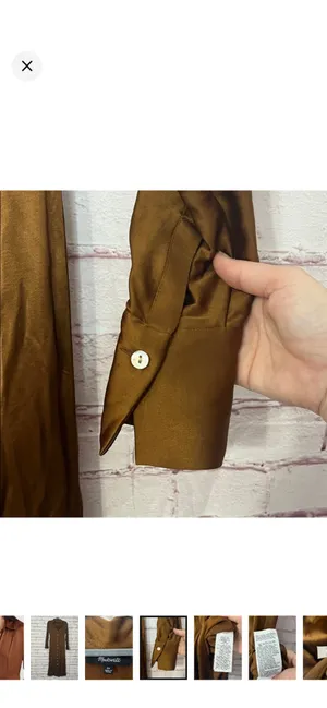Madewell Satin Button-Front Midi Shirtdress in Cedar Like New Size 00. Satin smooth. Beautiful buttons down the front. No stretch. 50” long 14” bust From the website: Coming in a shiny satin woven with eco-friendly Lenzing™ Ecovero™ viscose fibers, this pretty midi is our modern take on the retro shirtdress. Featuring a point collar, long sleeves and buttons all down the front, it's perfect to pair with tall boots. Body-skimming fit. Length from high point of shoulder: 52" (based on size 6). 57% polyester/43% Lenzing™ Ecovero™ viscose. Do Well: Made of Lenzing™ Ecovero™, a sustainable fabric created with natural fibers and a more eco-friendly process. Machine wash. Imported. Item NO175 thumbnail 7