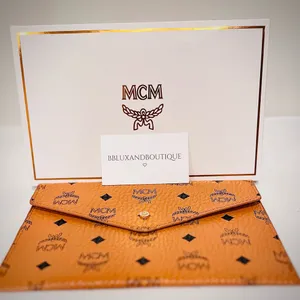 MCM Tangerine Logo Pattern Clutch thumbnail 8