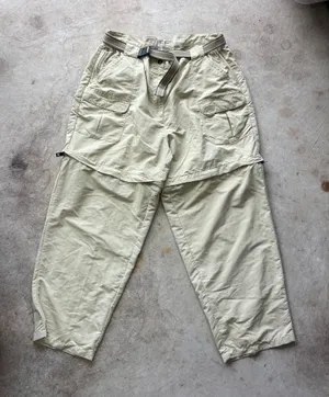 L.L. Bean convertible cargo hiking pants feature a built-in webbed belt and zip-off lower legs. thumbnail 1