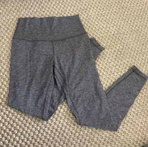 Lululemon Wunder Train High-Rise Tight 25" in Heathered Black thumbnail 1