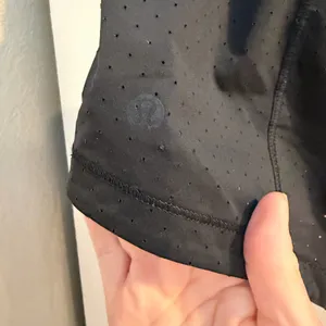This is a pair of black Lululemon Final Lap running shorts! size 6! thumbnail 4