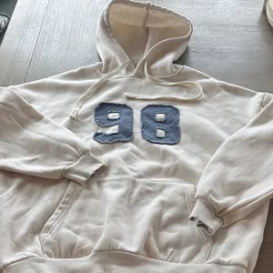 Edikted Cream Crewneck Hoodie with Distressed Blue '98' Patch thumbnail 1