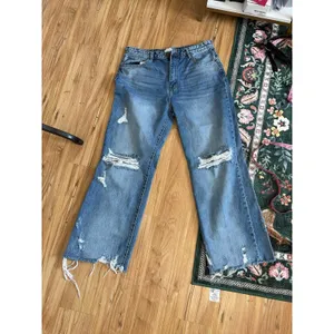 Petra 153 jeans w/ heavy knee destruction, whiskering, and a raw frayed hemline thumbnail 4