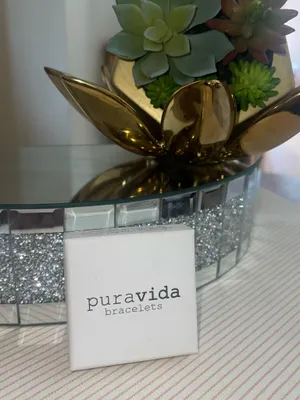 This is a Pura Vida bracelet featuring a dainty gold-tone wave charm thumbnail 6