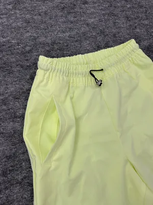 Nike Women's Sportswear Woven Pants in a bright neon green/yellow XS thumbnail 5