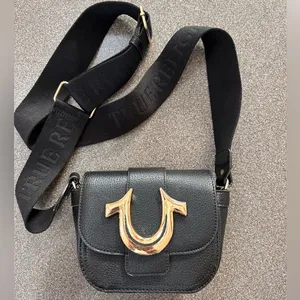 True Religion Black Crossbody Bag, Gold Accent, Adjustable Guitar Strap thumbnail 1