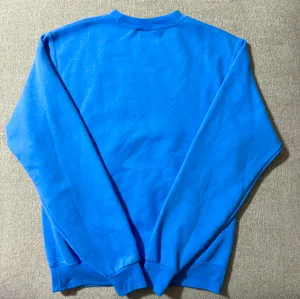 Champion University of Tennessee Lady Volunteers sweatshirt in a vibrant blue. thumbnail 4