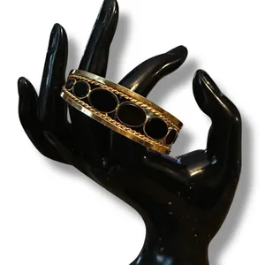 Gold tone open hinged bangle with oval black stones thumbnail 3