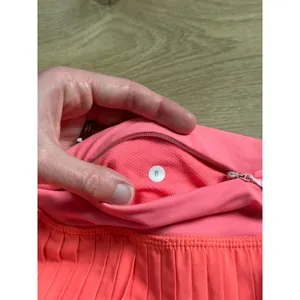 EUC Women Lululemon Pleat To Street Skirt II Grapefruit neon tennis skirt Size 8 thumbnail 3