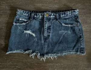 Free People distressed denim mini skirt with a frayed raw hem thumbnail 1