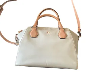 Kate Spade NEW YORK-MINT MOJITO PIPPA PARNELL STREET LEATHER SATCHEL Perfect spring bag, mint green white tan handle and crossbody strap, top zip closure, stripe print interior, inside zip pocket, inside two open pockets, amazing condition, there are two call outs, a small smudge on the bottom of the bag and a small smudge on one corner, please see the last two pictures **This bag is preowned and is being sold as is** thumbnail 12