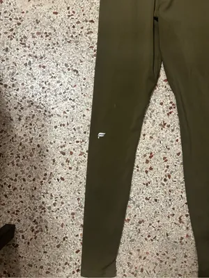 Fabletics Motion 365 onesie in olive green features a racerback design thumbnail 8