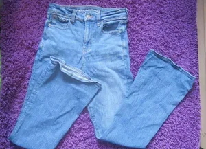American Eagle Outfitters next level stretch super hi-rise flare jeans in medium wash blue size 4. thumbnail 1