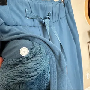 Lululemon On the Fly 7/8 Pant -‎ Size 4 either code blue or petrol blue pants thumbnail 7