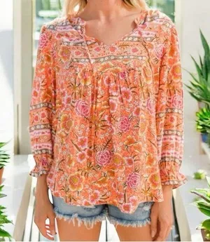 Umgee tangerine orange mix print floral top size M thumbnail 1