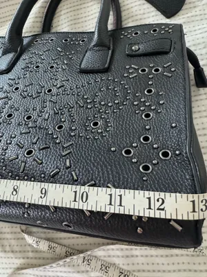Women’s black handle bag with metal design in the front thumbnail 8