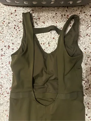 Fabletics Motion 365 onesie in olive green features a racerback design thumbnail 9