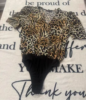 Modern animal-print bodysuit with a wrap neckline by "a... love story," size S thumbnail 1