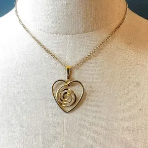 Gold tone heart swirl pendant necklace thumbnail 1
