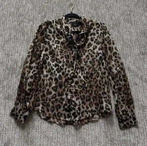 VICI Leopard Tie-Neck Blouse in Brown and Black thumbnail 1