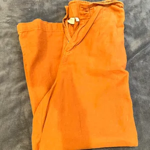 The Comfy Boutique burnt orange flared pants Size small Stretchy/ super comfy Color is like a burnt orange/brown thumbnail 2