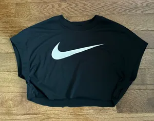 Nike women’s black cropped tee with white swoosh thumbnail 1