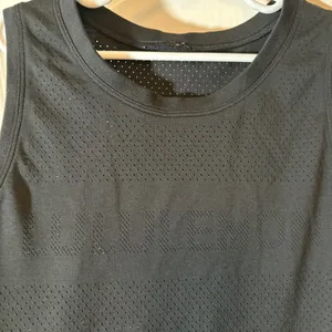 Lululemon spell out black tank 17 inches pit to pit. Preloved thumbnail 3