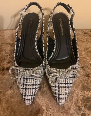 BCBGeneration Black and White Tweed Pointed Slingback Heels with Rhinestone Bow thumbnail 1