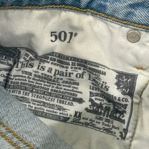 Vintage Levi's 501 light wash distressed jeans. Waist 27 (2" inseam) thumbnail 6
