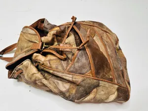 Vintage 1980s/90s Brown Leather Patchwork Clip Front Drawstring Backpack Bag thumbnail 1