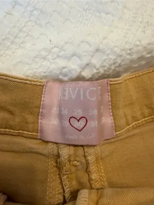 REVICE High-Rise Frayed Hem Jean Shorts in Mustard thumbnail 2