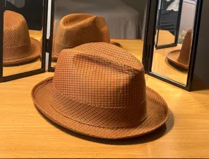This Men’s Top Hat in size Medium is a stylish and lightweight accessory perfect for casual occasions during the winter, fall, and spring seasons. Made of wool felt in a solid brown color, this handmade top hat exudes a classic and sophisticated look. With its unique style and comfortable fit, this top hat is sure to add a touch of elegance to any ensemble. thumbnail 3