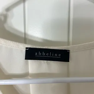 Abbeline women’s solid white elastic‎ cuff crossover high low relaxed blouse XS thumbnail 3