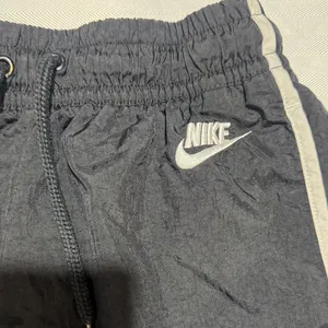 Nike Women's Black Athletic Shorts with White Piping thumbnail 2
