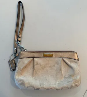 Coach | Gold Signature C Wristlet Bag. thumbnail 1