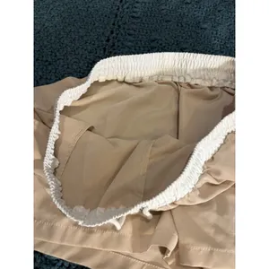 Tan Athletic Shorts with White Elastic Drawstring Waistband and Pockets thumbnail 3