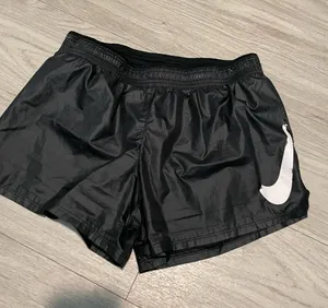 Nike Black Women’s Athletic Shorts with White Swoosh thumbnail 1