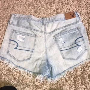 American Eagle distressed vintage high rise festival shorts light wash size 6​​ thumbnail 7