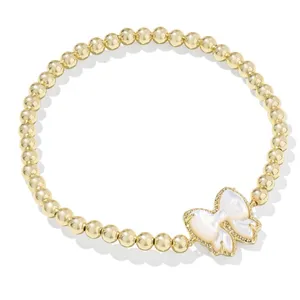 Kendra Scott Haley Bow Stretch Bracelet and matching ring set in gold thumbnail 4