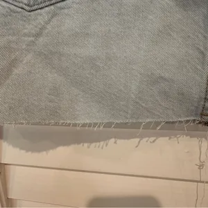 New Zara Ripped Denim Mini Skirt Sz L Distressed Hem Light Blue NWT thumbnail 10