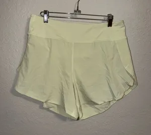 Athleta run with it shorts pastel lime green thumbnail 1