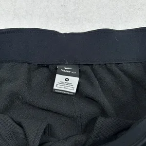 Nike Therma-FIT Women’s Sweatpants Medium Black Fleece Lined Zip Ankle Athletic thumbnail 4