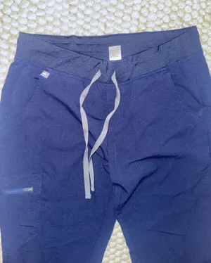 Navy blue FIGS technical collection scrub jogger pants thumbnail 1