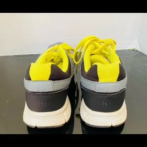 Nike women's Revolution Grey/Yellow Running Shoes. 9 thumbnail 4