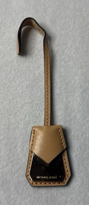 Michael Kors tan and silver keychain thumbnail 1