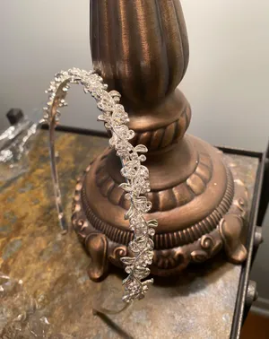 Silver metal headband with flowers and rhinestones on a vine thumbnail 1