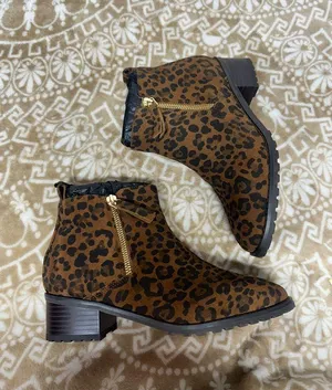Blondo Leopard Print Ankle Booties in Brown and Black thumbnail 1
